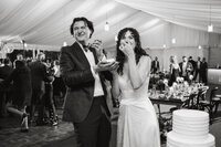 Candid photo of bride and groom at their outdoor wedding reception in Philadelphia. 