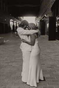 A couple hugging and embracing one another after a special moment