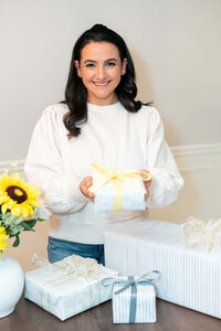 Aubrey of Graciously Gifted Holding a Gift Box