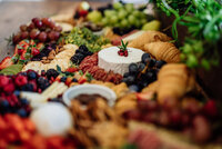Detail shot of cheese and assorted fruits