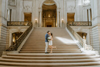 couple embracing on staircase