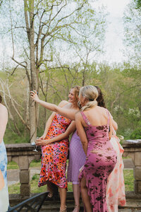 Wedding guests laughing and taking a selfie during an outdoor Pennsylvania celebration