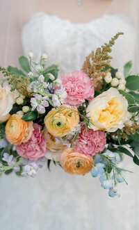 A bride holding her wedding bouquet