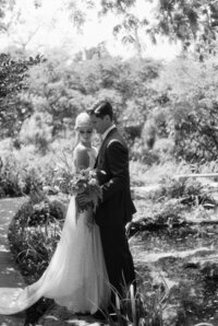 Couple hold each other close on wedding day but they look like they are from the20's