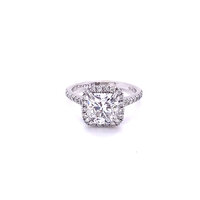 cushion cut white diamond with halo setting in white gold