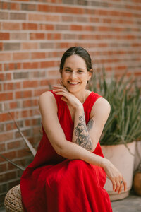 A photographer smiling and looking at the camera
