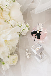 Cream and greenery bouquet, earrings, ring and perfume