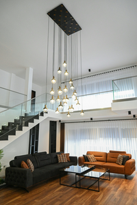 Modern open concept living room with large chandelier