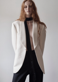 Female model wearing a luxury white blazer by Belance Tailors in Sydney