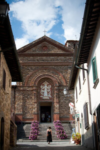 Woman in front of Tuscan Church