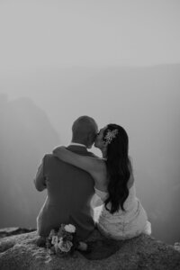 Bride kisses groom on the cheek