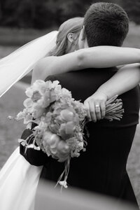 Photo of bride and groom embracing taken by Maine coast wedding photography