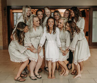 bride celebrating with bridesmaids