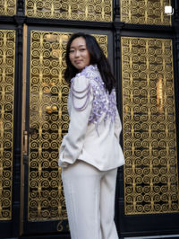 Bride in custom lavender floral beaded tailored suit at sunrise in San Francisco
