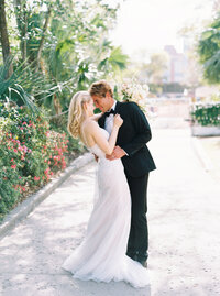 Wedding portrait of young couple embracing at a wedding venue in Charleston, South Carolina