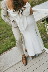 detail photo of bridal bow dress during couples portraits at bc wedding