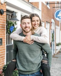 couple with woman doing piggy back