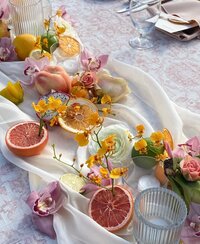 Wedding table setting decorated with tropical fruit and flowers designed by Sunrise blooms Kauai