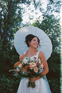 film photography of bride with umbrella