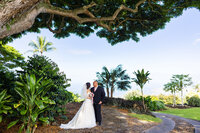 couple walking on the sand y beach and tidepools at sunset