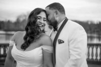 Bride and groom smiling and laughing at each other