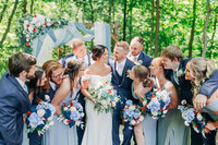 Close up photo of bride and groom with noses touching