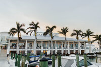 A beautiful view of the hotel with palm trees where guests are staying for a wedding