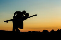 Unique engagement session featuring a romantic couple silhouette at dusk with a stunning view near Collegeville.
