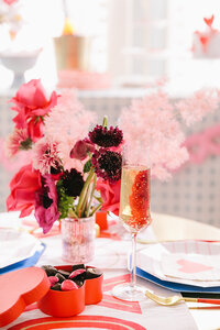 table setting of hearts and flowers in pink and red