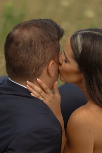 couple kisses on wedding day in pei