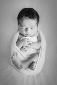 newborn swaddled baby sleeping for photos at studio in Princeton, NJ.