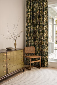 Velvet green ottoman with brown fringe