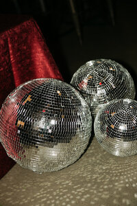 Flash photo of disco balls on the ground at a wedding reception