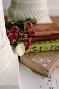 scattered papers showing images of flowers and logo designs
