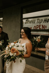 bride laughing with her crew at Lake Geneva Tap House