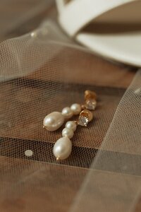 detail shot of brides earrings on wedding day in pei