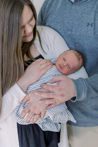 Mary and Levi holding their newborn baby Coleman