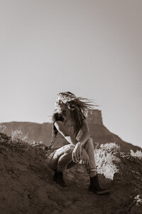 wild pines photography owner flipping hair at Castle Valley in Utah