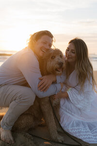 couple smiling with dog