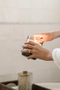 Person Lighting Candle