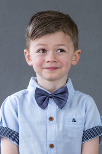 Boy wearing a bow tie for his school photos