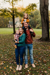 Family photographer capturing a mom, dad and two young children.