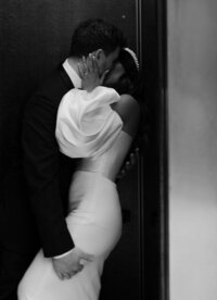 The bride and the groom-are kissing at the hotel
