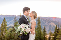 A Bride and Groom Get Close on the Wedding Deck at the Little Nell