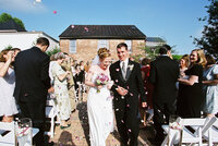 Kelly and her partner walk down the aisle