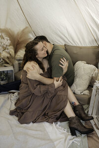 Boho Tent Couple's Sessions - Coupe Snuggle Up - Man kisses his wife's neck | Maryland Wedding Photographer | Tennessee Wedding Photographer | Ohio Wedding Photographer | Adventure Wedding & Elopement Photographer Nationwide