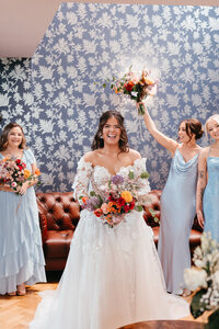 Bride and her bridesmaids holding flower bouquets at Castle Dargan in Sligo, Ireland