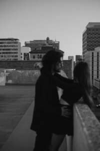 Couple posing on rooftop in albuqerque new mexico.