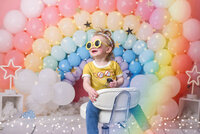 little girl  rainbow birthday photoshoot in the studio
