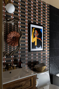 a dining room with a black, gold, and brown color scheme